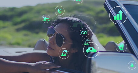Environmental data icons image over woman in sunglasses leaning on car