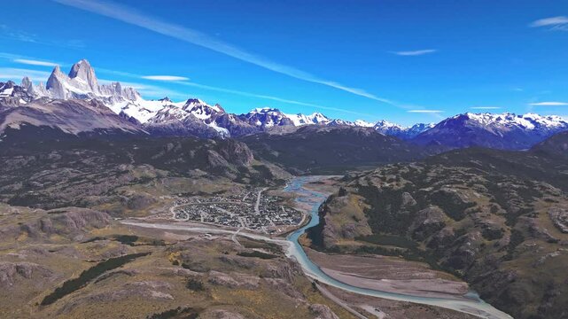 El Chalten: Gateway to Fitz Roy. This captivating drone footage showcases the stunning scenery that awaits hikers and adventurers, with the Rio de las Vueltas carving its way through the valley below.