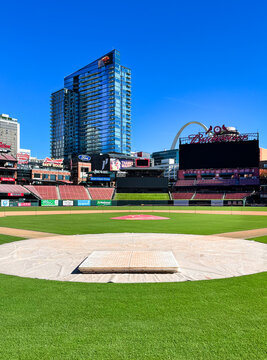 St. Louis, MO - USA: Busch Stadium - Ground level view of the baseball field from home plate. Clear, royal blue sky, full sunshine.