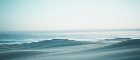 Fototapeta premium Soft dunes merge with the horizon under a gentle blue sky, capturing a serene and minimalist desert landscape sculpted by the whispering winds.