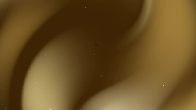 Gold swirling abstract background with tiny light points. Ideal for luxury branding, elegant designs, festive decorations, or highend presentations.
