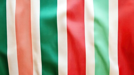 Close-up of vibrant multicolored striped fabric with soft folds and wrinkles.