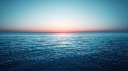Obraz premium Tranquil sunset over the calm ocean showcasing vibrant colors in the sky and water
