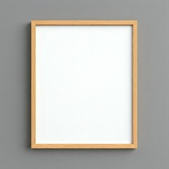 Obraz premium Blank white canvas with a wooden frame on a grey wall.