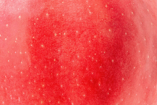 Red apple texture. Macro photo of apple skin. Vitamins, fruit
