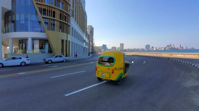 El Malecon, Havana, a broad landmark esplanade coastal that goes past city tourist attractions .
