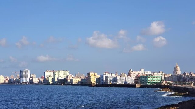 El Malecon, Havana, a broad landmark esplanade coastal that goes past city tourist attractions .