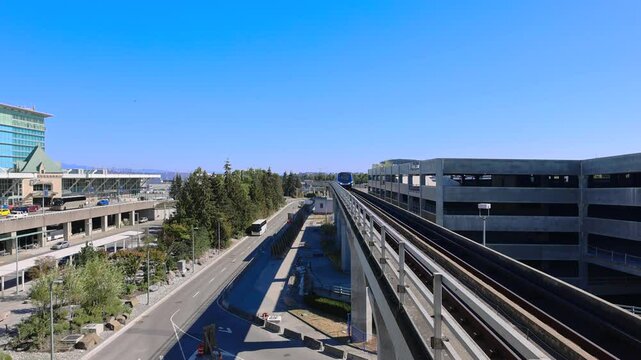 Vancouver train shuttle approaches the terminal at Vancouver International YVR Airport.