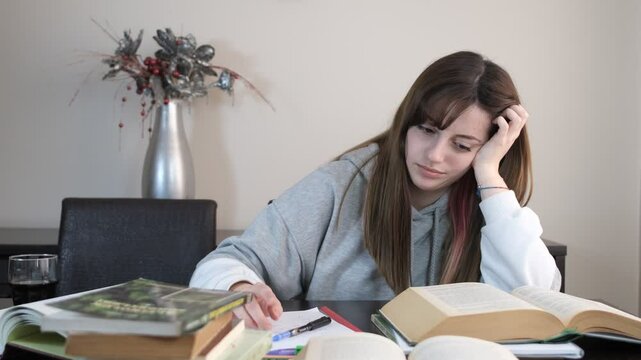 Depressed girl trying to study