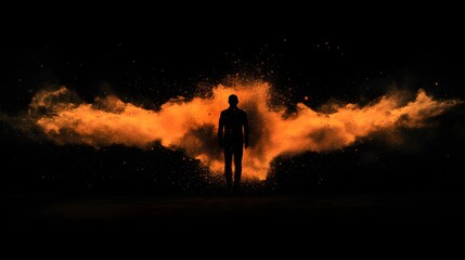 Silhouette Person Amidst Orange Powder Explosion