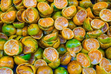 Orange peel is in the waste bin a the market fruit of Thailand 