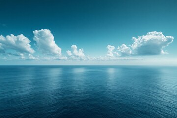 Calm ocean, blue sky, fluffy clouds, serene seascape. Perfect for travel, relaxation themes