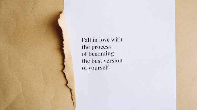 A torn beige paper partially covers a white sheet with the motivational text "Fall in love with the process of becoming the best version of yourself" in sans-serif font. Simple and inspiring design.

