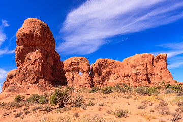 Fototapeta premium A large rock formation with a hole in the middle