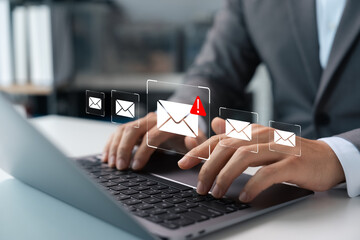 Email security, spam virus alert in email, businessman using smartphone to access email protected virtual screen, internet communication and network security.