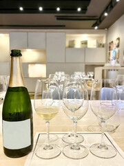 Wine Tasting Setup with Sparkling Wine Bottle and Glasses. 