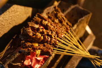 grilled beef satay at street stall in the night