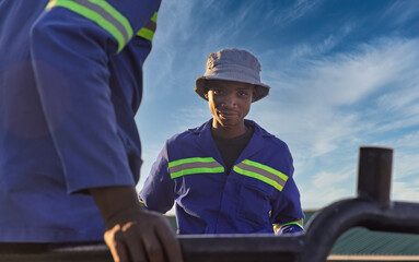 workers African in the back of pickup truck, going to work, transport, repair technician wearing...