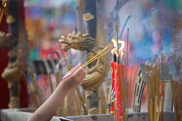2023 June 03,Hong Kong.Citizens light incense and candles to pray for blessings from gods