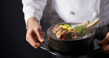 Galbitang in the hands of a chef, traditional Korean food