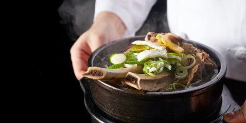 Galbitang in the hands of a chef, traditional Korean food