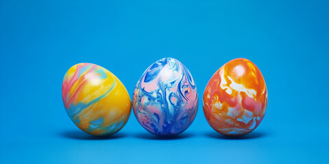 Colorful Speckled Easter Eggs on Blue Background