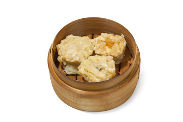 A traditional Chinese bamboo steamer filled with steaming hot shumai dumplings or Chinese Dimsum isolated on white background