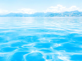 Tranquil Blue Water Meets Distant Hills Under a Serene Sky on a Summer Day