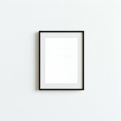 A blank framed portrait hanging on a white wall.