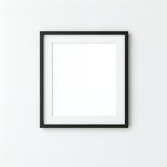 A blank white canvas in a black frame on a white wall.