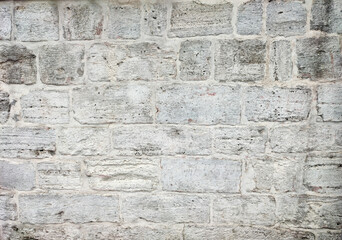 Ancient grey stone brick wall background