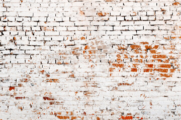 Old red brick wall with white stucco