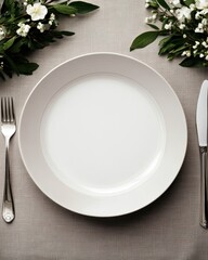 Elegant Table Setting with White Plate and Flowers