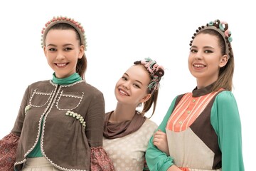 Three young women showcasing colorful headbands in a creative fashion display