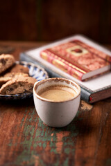 Cup of coffee and Cantuccini (Italian cookie) on dark wooden background. Copy space.