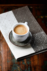 Cup of coffee on wooden background. Soft focus. Copy space.