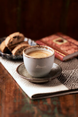 Cup of coffee and Cantuccini (Italian cookie) on dark wooden background. Copy space.