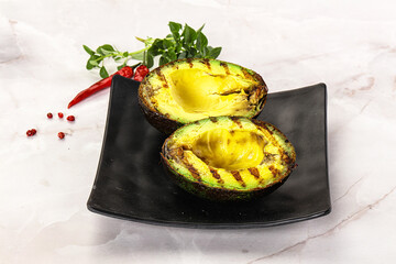 Sliced fresh avocado on the grill