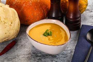 Vegan pumpkin cream soup served sesam