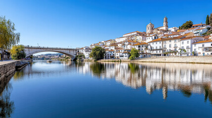 Fototapeta premium Scenic view of Coimbra historic center with reflections on river