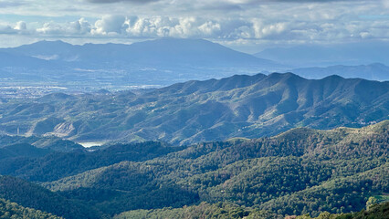 Naklejka premium View from Montes de Málaga Malaga Natural Park onto the city