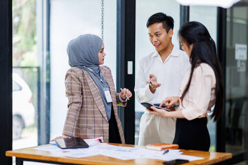 Young business asian colleague discussion with window background Financial Advisor discussion with client.