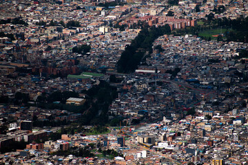 Aerial View of a cloud shadow on Expansive Urban Cityscape, Bogota