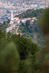 Famous Bogota church on mountain peack with city at background