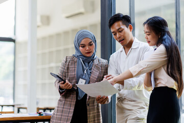 Young business asian colleague discussion with window background Financial Advisor discussion with...