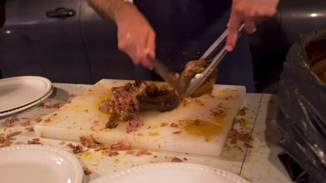 Person preparing birria. Typical food from Jalisco made with lamb meat.