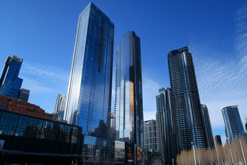 Naklejka premium Modern Skyscrapers Against a Blue Sky