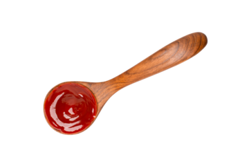 Tomato sauce in spoon isolated