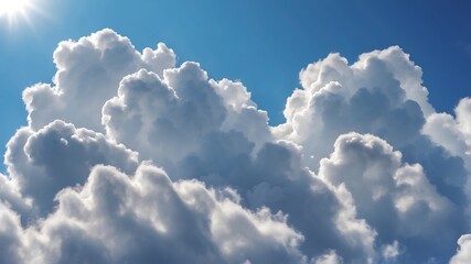 Big white clouds in bright blue sky with sunlight
