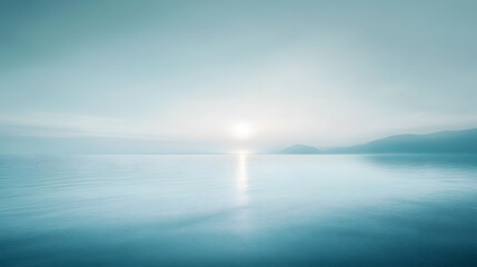 A soft horizon blending with light mist over calm waters.